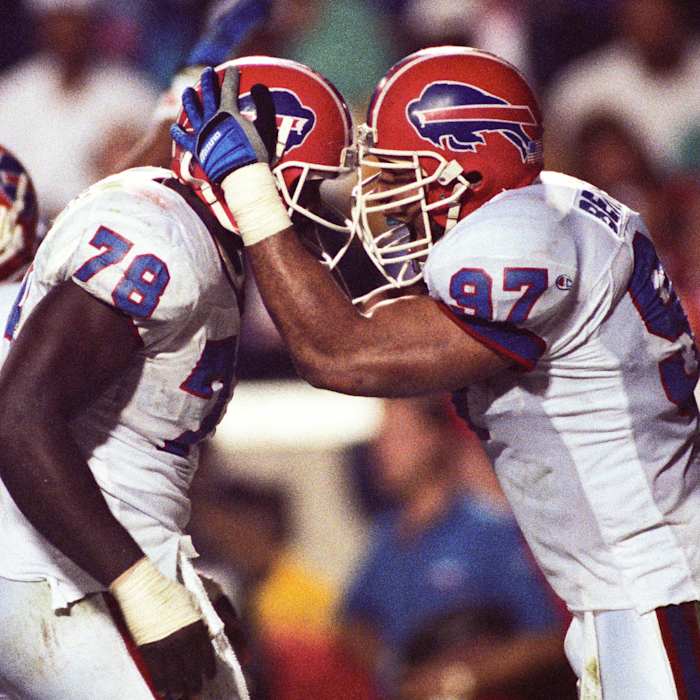 Buffalo Bills defensive end Bruce Smith (78) and linebacker Cornelius Bennett (97) react on the field during Super Bowl XXV against the New York Giants at Tampa Stadium. The Giants defeated the Bills 19-20.