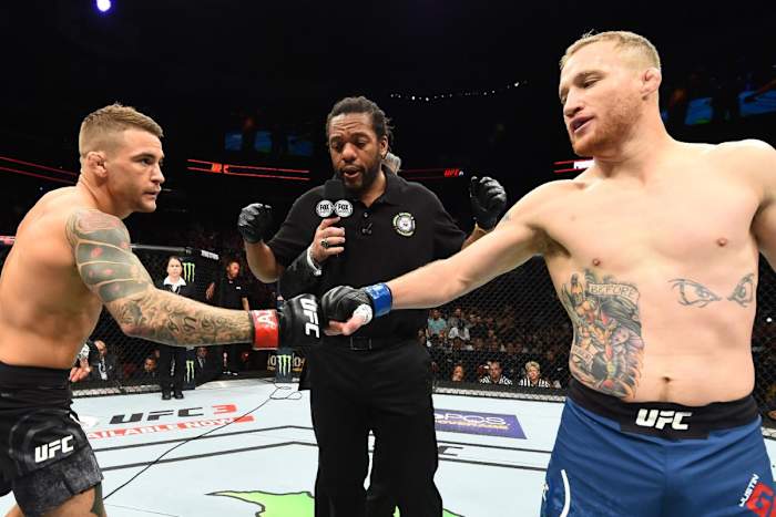 Former interim UFC lightweight titleholders Dustin Poirier and Justin Gaethje touch gloves before their 2018 showdown.