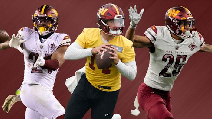 Washington Commanders quarterback Sam Howell (center), running back Antonio Gibson (left), and cornerback Benjamin St-Juste (right).