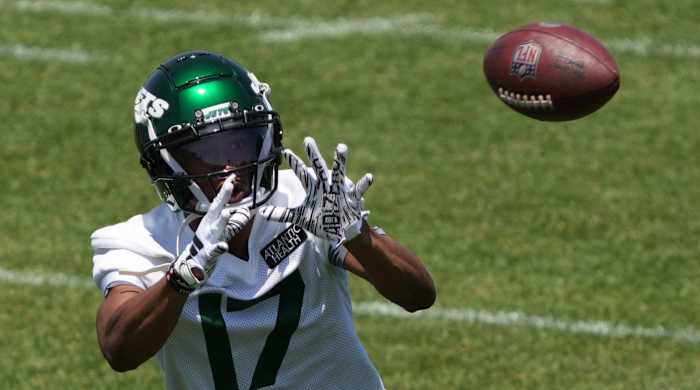 Jets receiver Garrett Wilson attempts to catch a pass during practice.