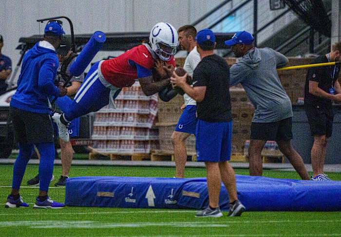 Indianapolis Colts quarterback Anthony Richardson (5) takes a leap Friday, July 28, 2023, during an indoor practice at Grand Park Sports Campus in Westfield, Indiana.