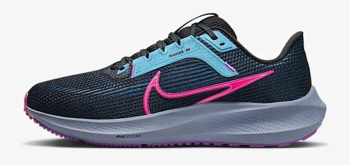 Side view of a black and pink Nike running shoe.