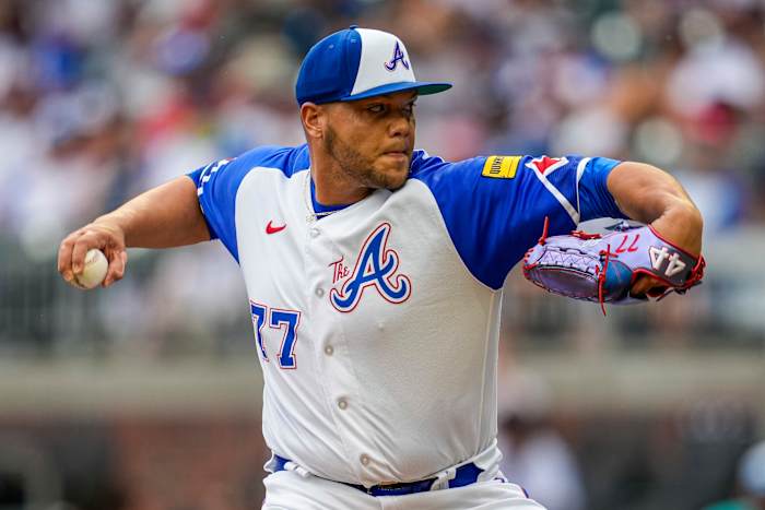 Jul 1, 2023; Cumberland, Georgia, USA; Atlanta Braves relief pitcher Joe Jimenez (77) pitches against the Miami Marlins during the ninth inning at Truist Park. Mandatory Credit: Dale Zanine-USA TODAY Sports
