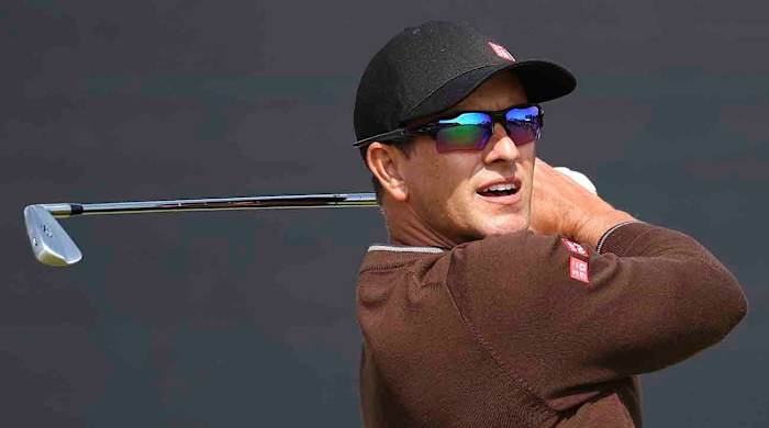 Adam Scott watches a shot at the 2023 British Open at Royal Liverpool.