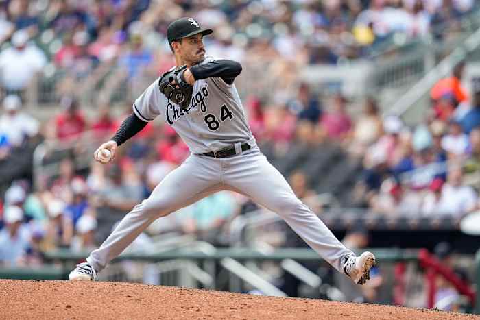 Dylan Cease brings his arm back to throw a pitch