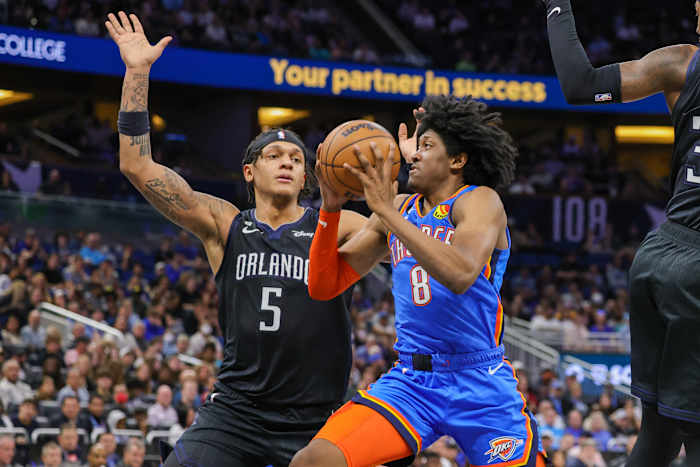 Jan 4, 2023; Orlando, Florida, USA; Oklahoma City Thunder forward Jalen Williams (8) drives to the basket against Orlando Magic forward Paolo Banchero (5) during the second quarter at Amway Center.