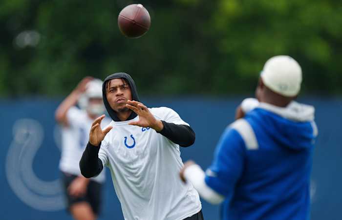 June 14, 2023; Indianapolis, IN, USA; Indianapolis Colts running back Jonathan Taylor (28) passes on the sideline Wednesday, June 14, 2023, during mandatory minicamp at the Indiana Farm Bureau Football Center in Indianapolis.