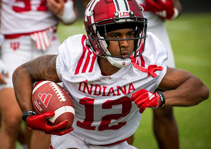 Indiana's Jaylin Lucas (12) runs during a drill during the first day of fall camp for Indiana football at their practice facilities on Wednesday, Aug. 2, 2023.