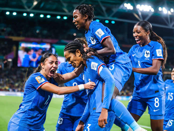 Wendie Renard of France is stormed by teammates after she scored the winning goal against Brazil at the Women's World Cup.