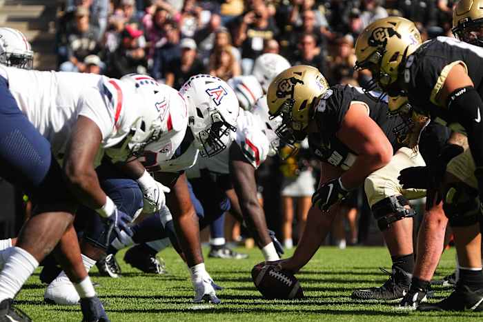 Arizona Wildcats line up across from the Colorado Buffaloes in the first quarter at Folsom Field