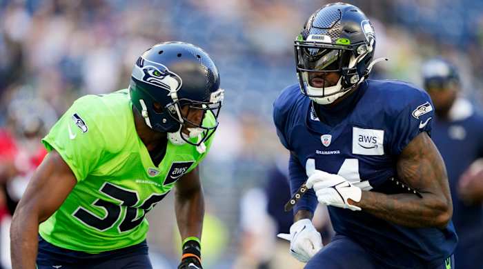 Seahawks cornerback Michael Jackson, left, defends against wide receiver DK Metcalf.