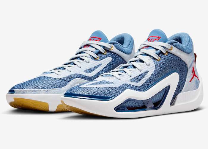 Side view of Jayson Tatum's blue, white, and red Jordan Brand shoes.