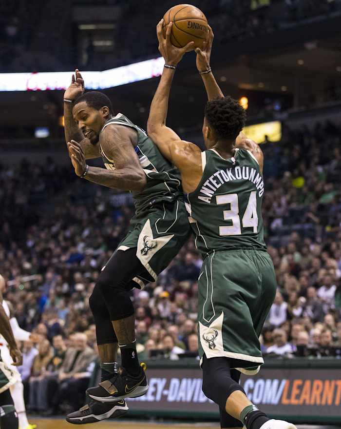 Milwaukee Bucks forward Giannis Antetokounmpo (34) grabs a rebound above guard Brandon Jennings (11) 