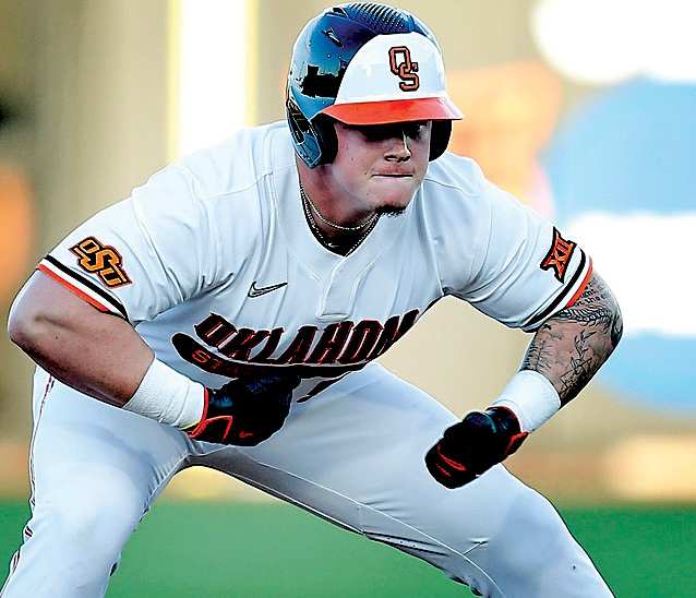 Oklahoma State's Griffin Doersching stops down at second to issue a gorilla pound on his chest during the NCAA Stillwater Regional baseball game between Oklahoma State Cowboys and Missouri State Bears at the O'Brate Stadium in Stillwater.