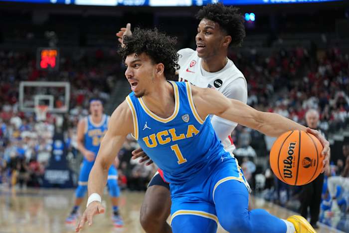 UCLA Bruins guard Jules Bernard (1) dribbles behind Arizona Wildcats guard Justin Kier (5) during the first half at T-Mobile Arena.