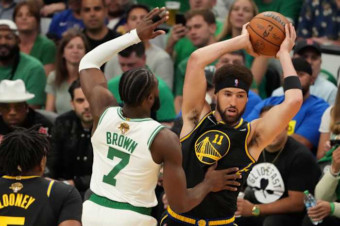 Jun 8, 2022; Boston, Massachusetts, USA; Golden State Warriors guard Klay Thompson (11) looks to pass the ball in front of Boston Celtics guard Jaylen Brown (7) in the first quarter during game three of the 2022 NBA Finals at TD Garden. Mandatory Credit: Kyle Terada-USA TODAY Sports