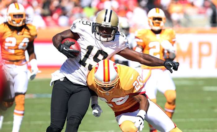 October 21, 2012; New Orleans Saints receiver Devery Henderson (19) after a catch as Tampa Bay Buccaneers safety Ronde Barber (20) defends. Mandatory Credit: Kim Klement-USA TODAY Sports