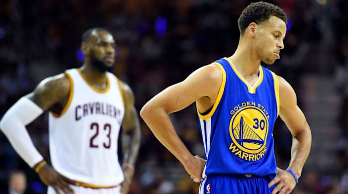 Cavs forward LeBron James and Warriors guard Stephen Curry compete in the 2015 NBA Finals.