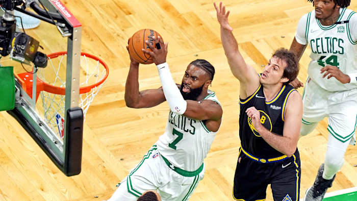 Boston Celtics guard Jaylen Brown (7) shoots the ball against Golden State Warriors forward Nemanja Bjelica (8) during the fourth quarter during game four of the 2022 NBA Finals.