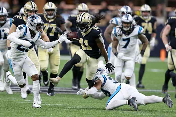 New Orleans Saints running back Alvin Kamara (41) escapes Carolina defensive backs Myles Hartsfield (38) and cornerback Rashaan Melvin (29). Mandatory Credit: Chuck Cook-USA TODAY Sports
