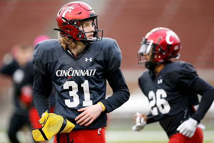Cincinnati Bearcats punter Mason Fletcher (31) crosses the field between drills during a spring practice at Nippert Stadium in Cincinnati on Thursday, March 24, 2022. Cincinnati Bearcats Spring Practice