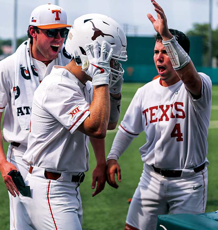 Texas infielder Mitchell Daly (19) puts on a Texas football helmet to celebrate a home run against Kansas at Disch-Falk Field in Austin, Texas on May 21.