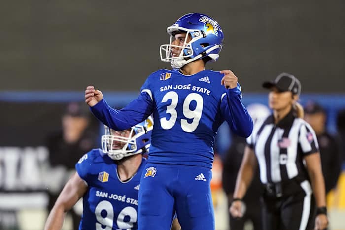 Oct 15, 2021; San Jose, California, USA; San Jose State Spartans place kicker Matt Mercurio (39) kicks a field goal as punter Will Hart (99) holds during the fourth quarter against the San Diego State Aztecs at CEFCU Stadium. Mandatory Credit: Darren Yamashita-USA TODAY Sports