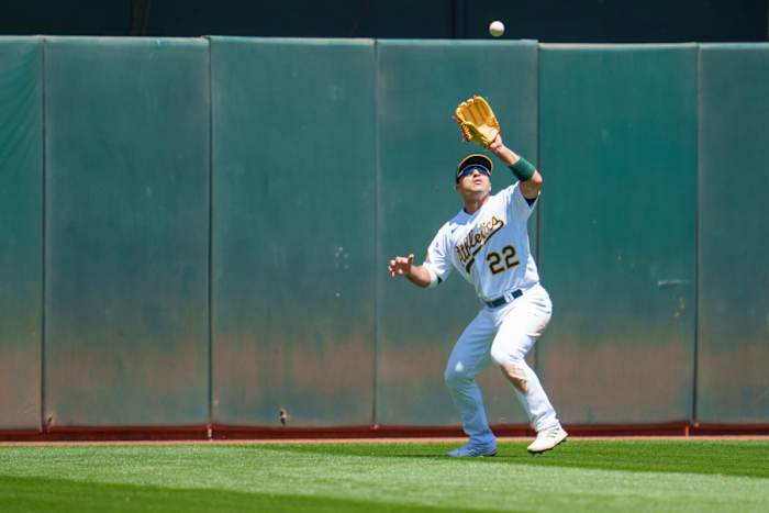 Ramon Laureano fields a fly ball against the Minnesota Twins