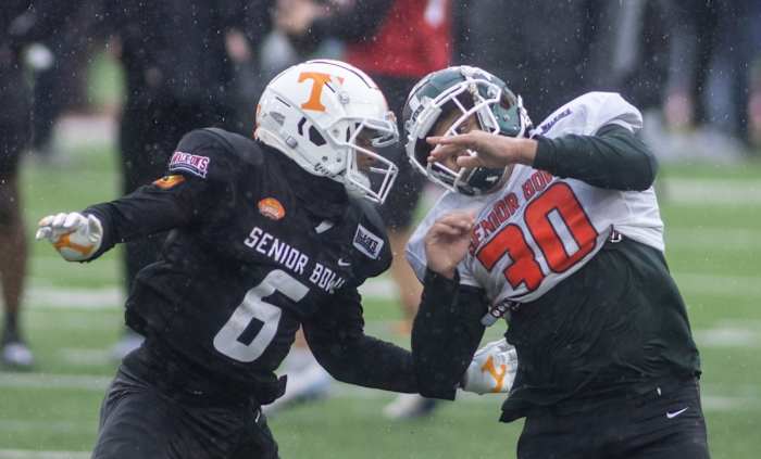 Alontae Taylor of Tennessee (6) and fullback Connor Heyward of Michigan State (30) during American team practice for the 2022 Senior Bowl. Mandatory Credit: Vasha Hunt-USA TODAY Sports