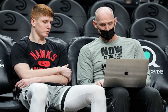 Atlanta Hawks guard Kevin Huerter (3) (left) talks with assistant coach Chris Jent center prior to the game against the Minnesota Timberwolves at State Farm Arena.