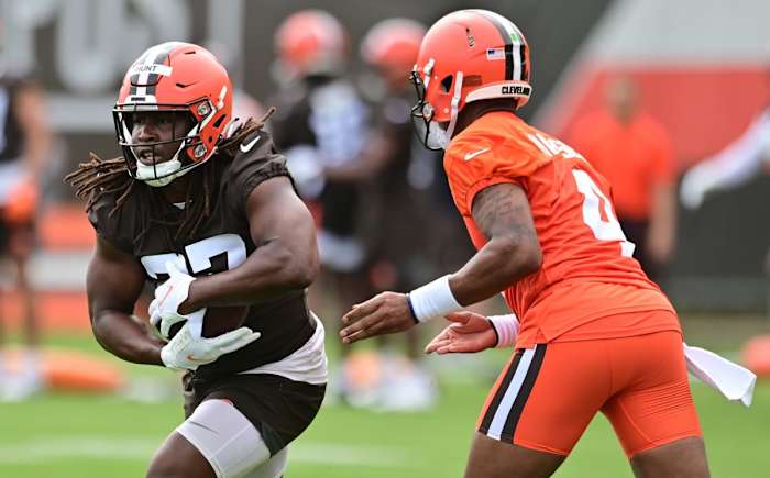 May 25, 2022; Berea, OH, USA; Cleveland Browns quarterback Deshaun Watson (4) hands off to running back Kareem Hunt (27) during organized team activities at CrossCountry Mortgage Campus. Mandatory Credit: Ken Blaze-USA TODAY Sports
