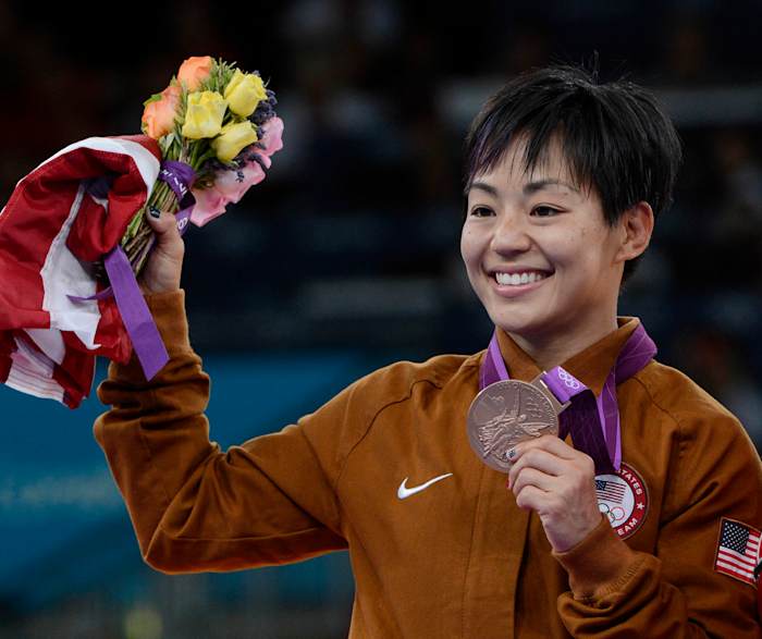 Clarissa Chun posing with her bronze medal at the London 2012 Olympic Games.