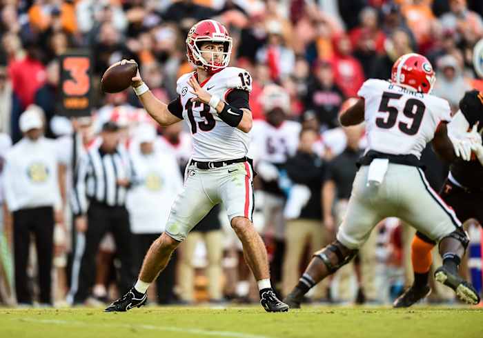 Nov 13, 2021; Knoxville, Tennessee, USA; Georgia Bulldogs quarterback Stetson Bennett (13) sets up to pass during the first half against the Tennessee Volunteers at Neyland Stadium. Mandatory Credit: Bryan Lynn-USA TODAY Sports