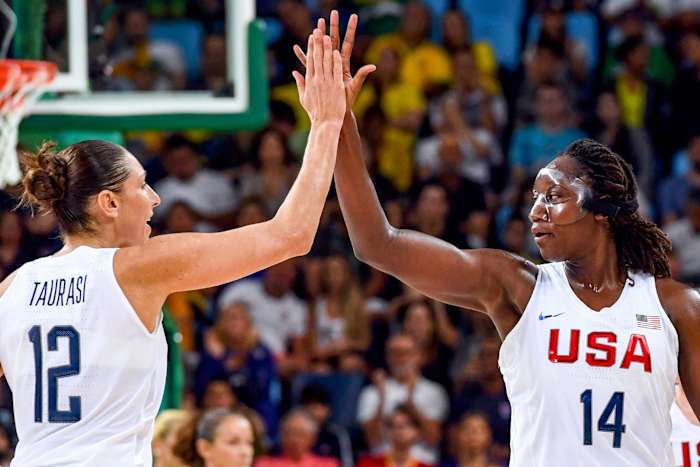 Diana Taurasi and Tina Charles high-five in Team USA uniforms