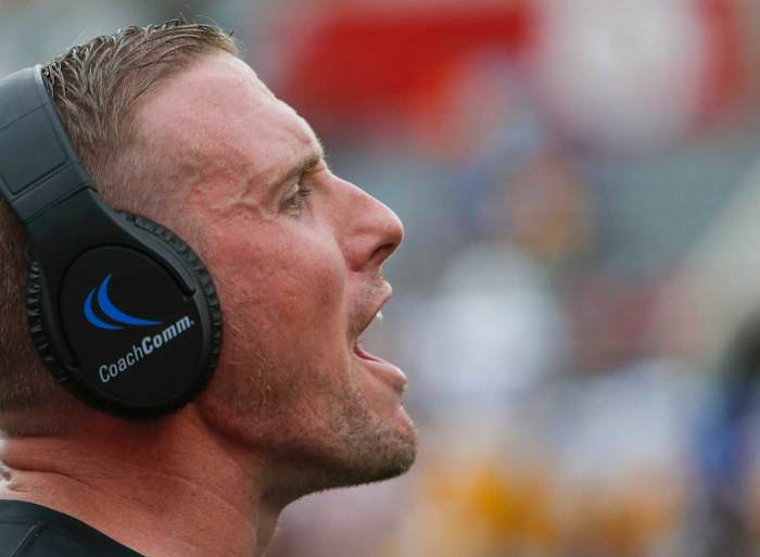 Austin Peay head coach Scotty Walden yells to his players from the sideline for "Governor energy" in a OVC football game between the Austin Peay Governors and Morehead State Eagles at Fortera Stadium in Clarksville, Tenn., on Saturday, Sept. 18, 2021.