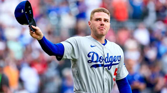 Los Angeles Dodgers first baseman Freddie Freeman walks to the field for the presentation of his World Series championship ring, before the team’s baseball game against the Atlanta Braves on Friday, June 24, 2022 in Atlanta.