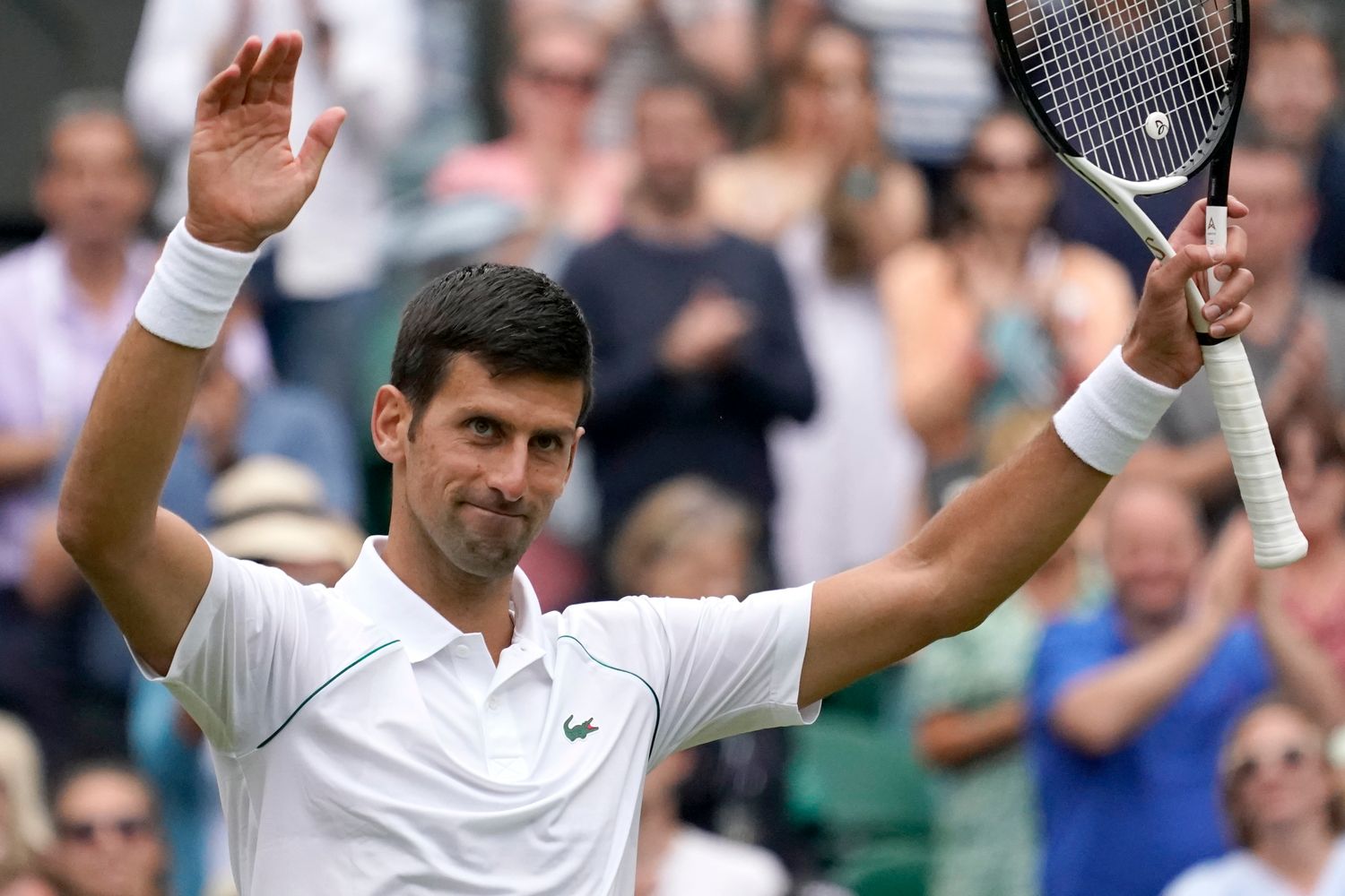 Novak Djokovic thanks the crowd at Wimbledon.