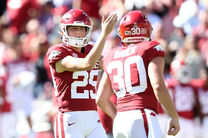 Oct 16, 2021; Fayetteville, Arkansas, USA; Arkansas Razorbacks kicker Cam Little (29) signals to his holder Reid Bauer (30) during the second quarter against the Auburn Tigers at Donald W. Reynolds Razorback Stadium. Mandatory Credit: Nelson Chenault-USA TODAY Sports