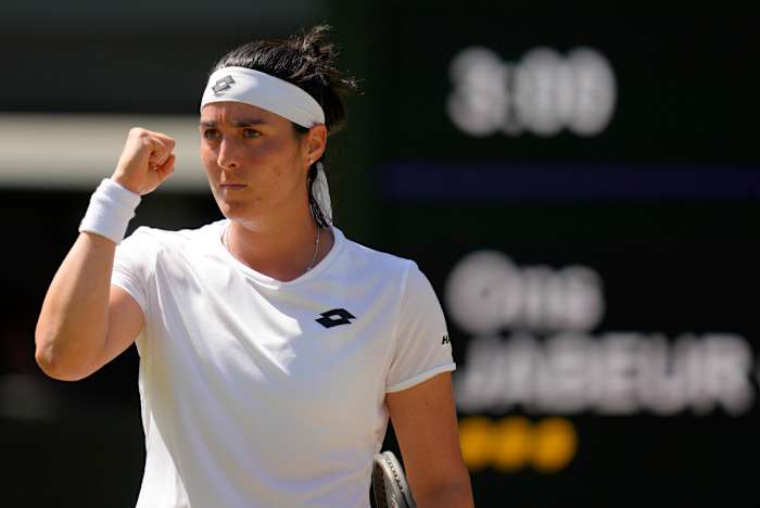 Ons Jabeur celebrates after advancing at Wimbledon