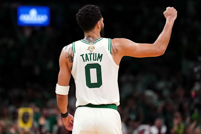 Jayson Tatum fist pumps during a game.