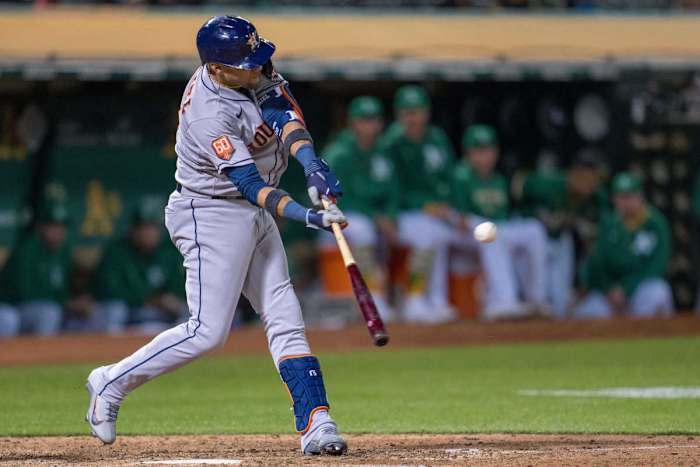 Yuli Gurriel slugs a single in the ninth innings against the Oakland Athletics.