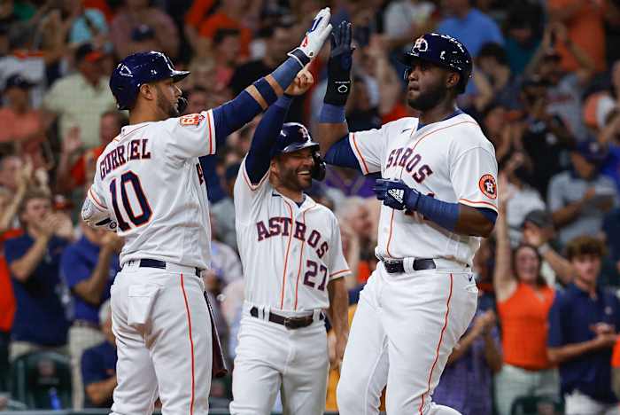 Houston Astros' Yordan Álvarez, José Altuve and Yuri Gurriel