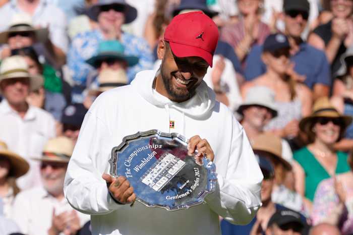 Nick Kyrgios with runner-up trophy at Wimbledon.