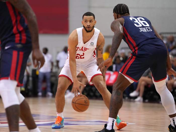 Atlanta Hawks guard Tyrese Martin (22) dribbles against New Orleans Pelicans center Tyrique Jones (36) during an NBA Summer League game at Cox Pavilion.