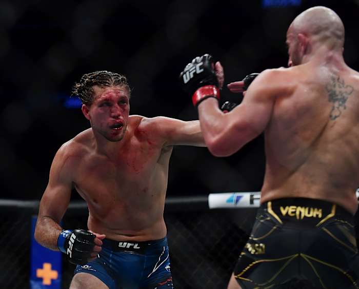 Brian Ortega moves in for a hit against Alexander Volkanovski during UFC 266 at T-Mobile Arena.