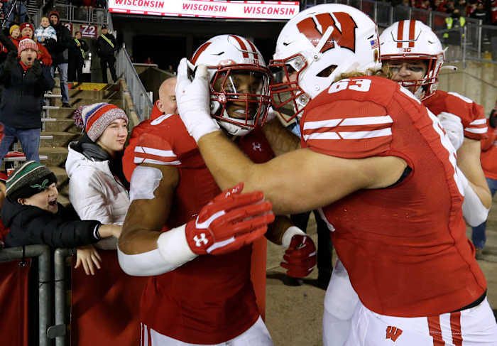Wisconsin guard Tanor Bortolini celebrating with running back Braelon Allen after a touchdown run (Credit: MARK HOFFMAN/MILWAUKEE JOURNAL SENTINEL / USA TODAY NETWORK)
