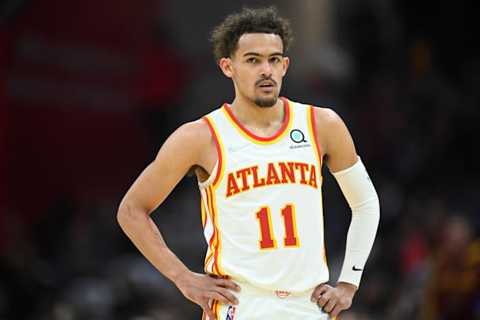 Trae Young standing during a game.