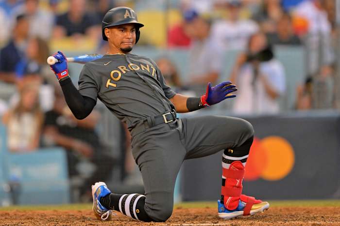 Santiago Espinal avoids a pitch.