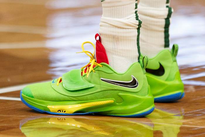 View of green Nike Zoom Freak shoes.