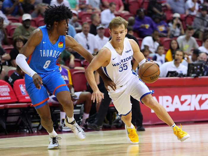 Jul 15, 2022; Las Vegas, NV, USA; Golden State Warriors guard Mac McClung (55) dribbles against Oklahoma City Thunder guard Jalen Williams (8) during an NBA Summer League game at Thomas & Mack Center. Mandatory Credit: Stephen R. Sylvanie-USA TODAY Sports